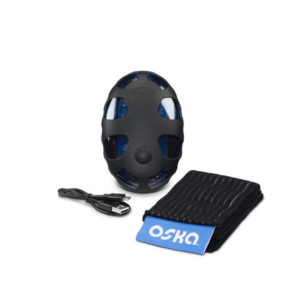Oska Wellness products displayed, including a charging wire and elastic strap