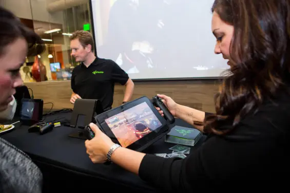 A group of employees demo new video game technology