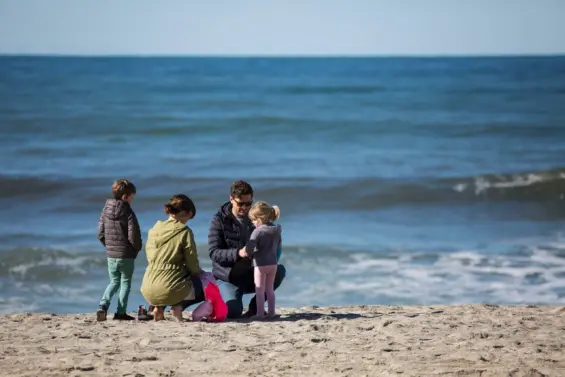 Family gathers on one of the Carlsbad, California beaches