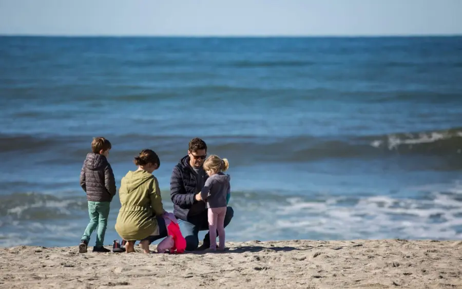 Family gathers on one of the Carlsbad, California beaches