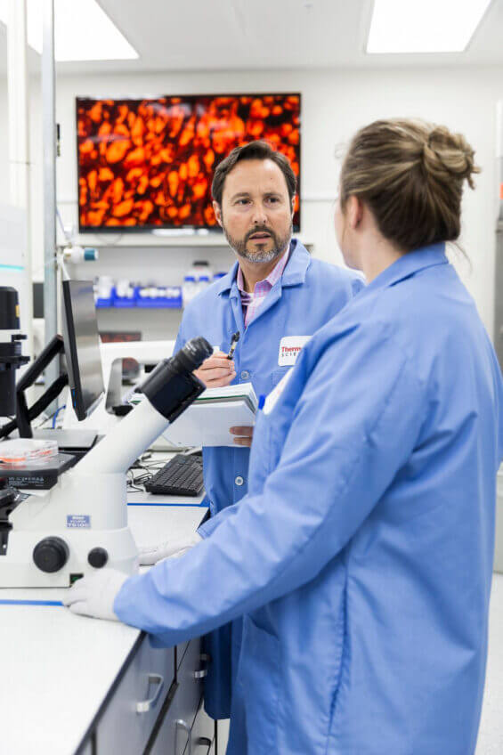 A team of scientists working in a lab in Carlsbad